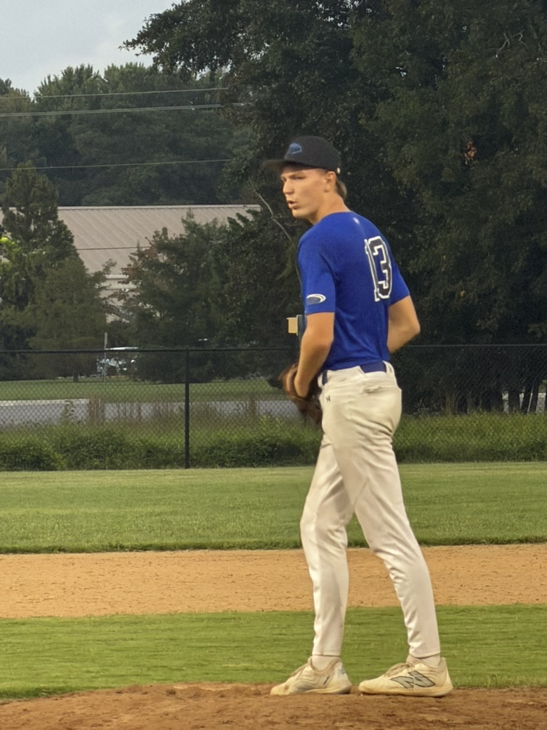 Brayden looking toward home plate while preparing to pitch